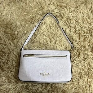 purple Kate Spade small handbag.